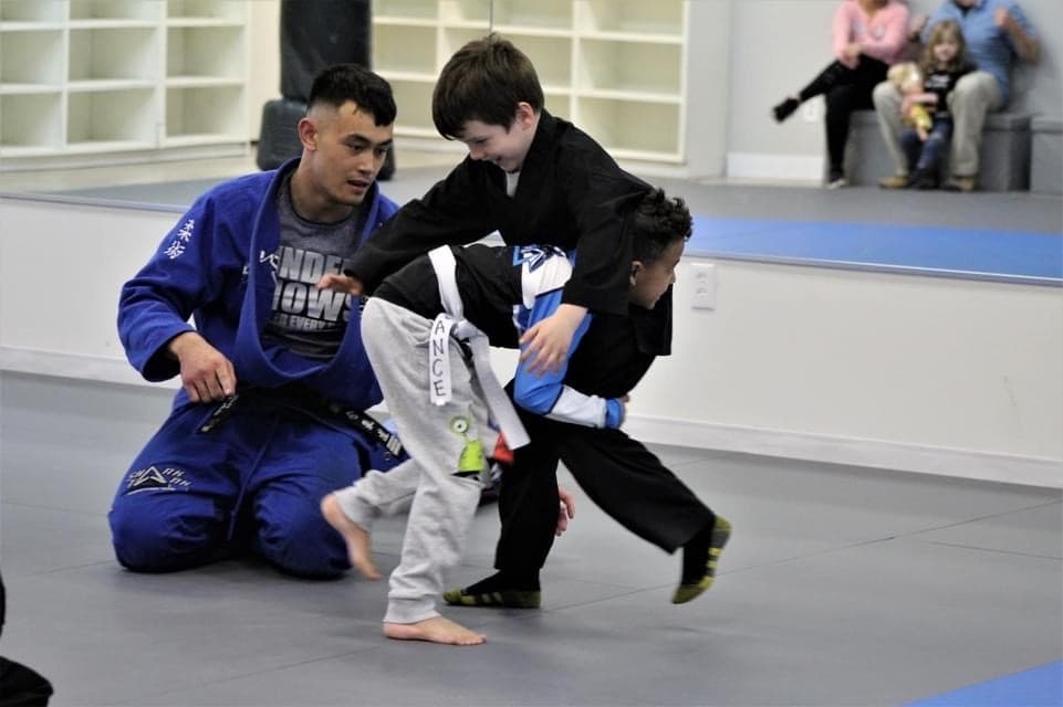 Young students in a beginner martial arts class
